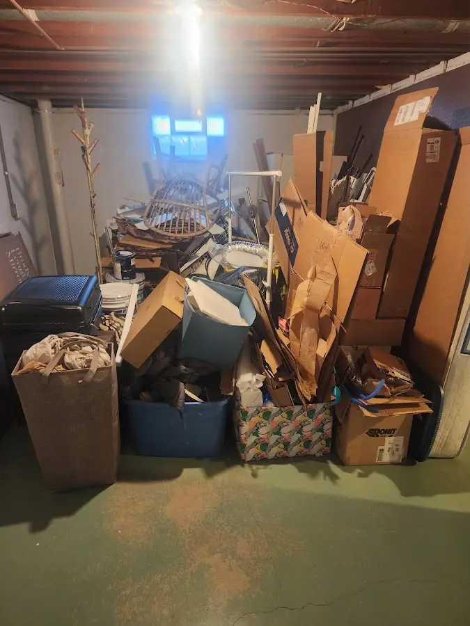 Roll-off dumpster container at job site for 2 Yard Dumpster Rental in Norton Shores